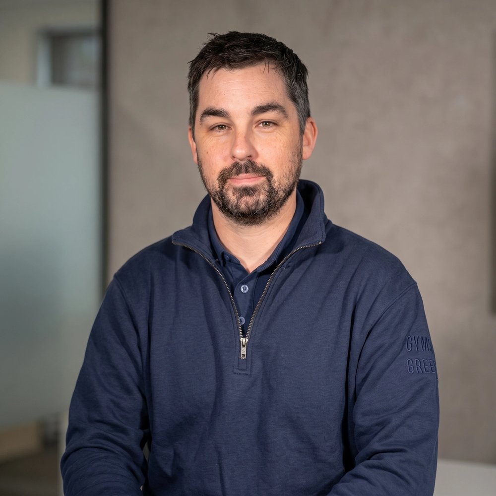 Portrait of Daniel McGivern, Co-Founder & Director of Amden Group